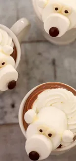 Adorable hot chocolate with bear-shaped marshmallow design in mugs.