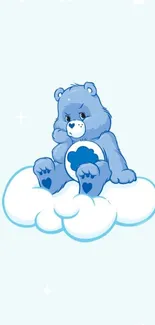 Adorable blue bear sitting on a fluffy cloud.