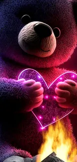 Cute teddy bear holding a glowing pink heart with a fire below.