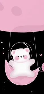 Cute teddy bear swinging under pink moon.