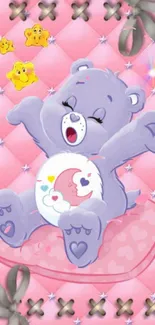 Cute cartoon bear stretches on pink cushion with stars.