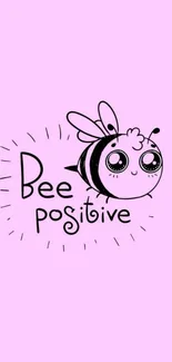 Cute bee with 'bee positive' text on pastel pink wallpaper.