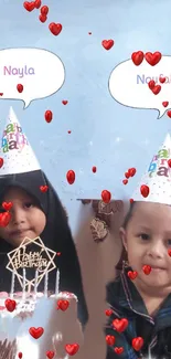 Adorable kids in party hats celebrate birthday with cake and hearts.