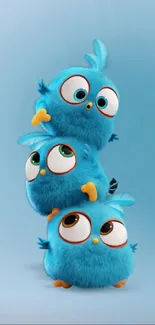 Adorable wallpaper with three fluffy blue birds stacked playfully.