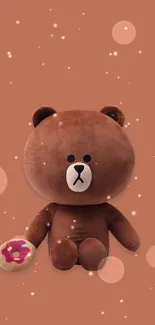 Adorable plush brown bear holding a donut on a copper background.