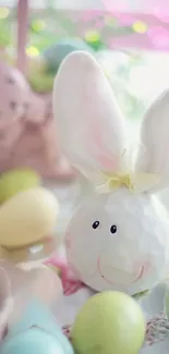 Adorable bunny with pastel Easter eggs and soft pink background.