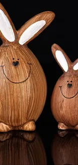 Cute wooden bunny figurines on a black background.