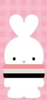 Adorable white bunny with pink scarf on a pink checkered background.