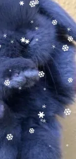 Fluffy bunny surrounded by snowflakes on a slate blue background.