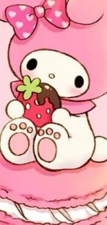 Cute bunny in pink sitting on a macaron holding a strawberry.