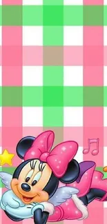 Cute pink cartoon character with checkered background.