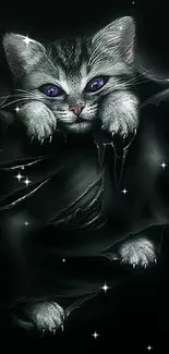 Cute kitten with piercing eyes in a dark, mysterious wallpaper.