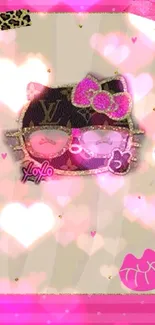 Cute cat with sunglasses and pink bow on pink patterned wallpaper.