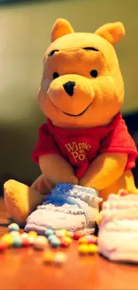 Cute plush character with colorful candies on a table.
