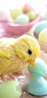 Charming yellow chick with pastel Easter eggs background.