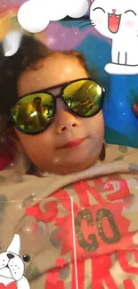 Playful child in sunglasses with cartoon pets, creating a fun wallpaper.