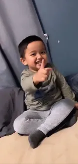 Cute child sitting on a cozy bed, smiling warmly.