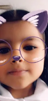 Cute child with cat face filter and glasses wallpaper.