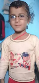 Cute child wearing glasses with a happy expression indoors.