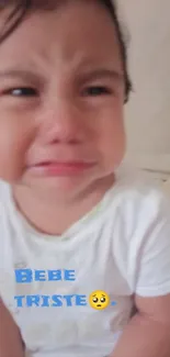 Adorable baby crying with beige background.