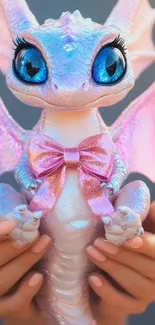 Cute pink dragon with blue eyes and a bow.