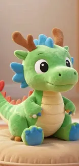 Cute dragon plush toy sitting on a cushion.