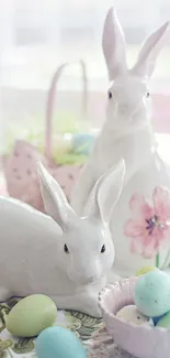 Cute white bunnies with pastel colored Easter eggs.