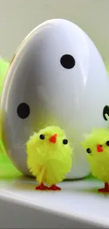 Adorable Easter chicks with decorated egg.