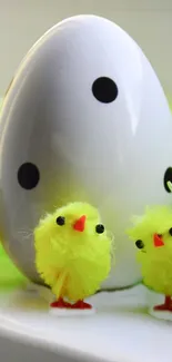 Easter-themed mobile wallpaper with yellow chicks and a polka-dotted egg.