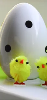 Cute yellow chicks with a large decorative egg.