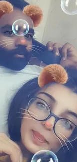 Couple with animal filters and bubbles on phone wallpaper.