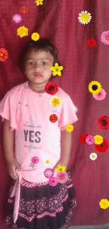 Girl in pink dress with colorful flowers on red background.