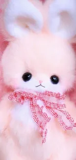 Adorable fluffy pink bunny with bow on soft pastel background.