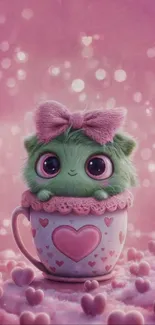 Cute green furry creature in cup with pink hearts.