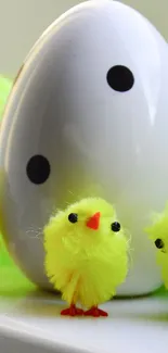 Yellow fuzzy chicks with polka-dotted egg.