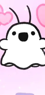 Cartoon ghost with pink heart background on mobile wallpaper.