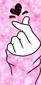 Cartoon hand heart gesture on pink background wallpaper.