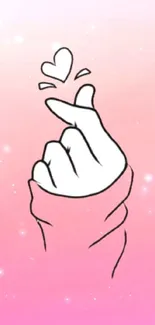 Minimalist pink wallpaper with heart hand gesture.