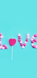 Heart candy forming 'LOVE' on a blue background wallpaper.