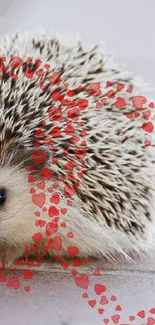 Cute hedgehog with red heart designs on a soft background.