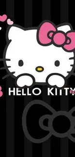 Cute Hello Kitty wallpaper with pink bow and black background.