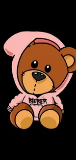 Cute teddy bear in a pink hoodie on black background wallpaper.