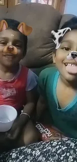 Two kids with dog filters, smiling joyfully and playfully.