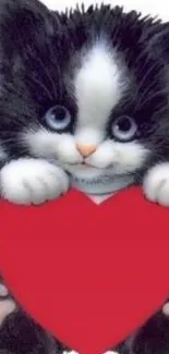 Cute kitten holding a big red heart.