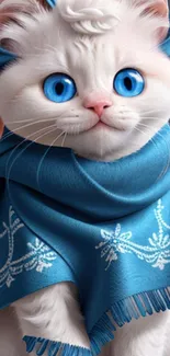 White kitten with blue eyes wearing a decorative blue scarf.