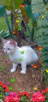 Cute white kitten in garden with flowers.