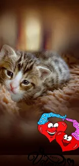 Cute kitten with Valentine's Day hearts on a cozy blanket wallpaper.