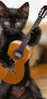 Black kitten holding tiny guitar mobile wallpaper.