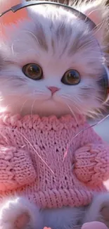 Adorable fluffy kitten with headphones and a pink sweater, perfect for mobile screens.