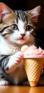 Cute kitten with an ice cream cone against a brown background.